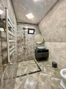 a bathroom with a shower and a toilet at A Frame Lerik in Lerik