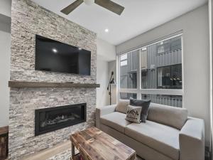 a living room with a couch and a fireplace at 58B 2Br 2,5Ba townhouse in Silverthorne