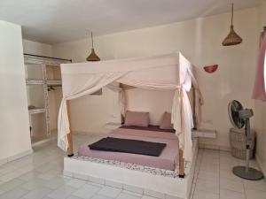 Postel nebo postele na pokoji v ubytování Le Paradis