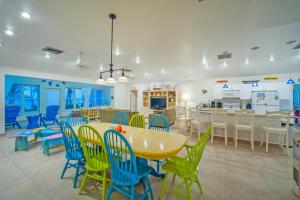 a dining room with a table and chairs at Coconut Beach by Grand Cayman Villas & Condos in Driftwood Village