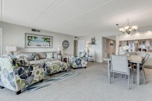 a living room with a couch and chairs and a table at G3 Amelia South condo in Fernandina Beach