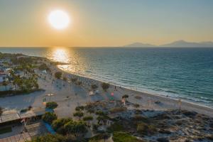 an aerial view of a beach at sunset at Anthia Apartments in Marmari