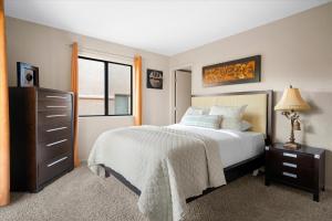 a bedroom with a bed and a dresser and a window at 100 Bell Rock Condo- Supai condo in Sedona
