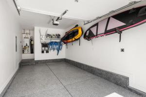 a room with a kayak hanging on the wall at Lagoon Vibes townhouse in St. George