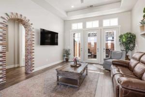 a living room with a couch and a coffee table at The Ella home in Hurricane