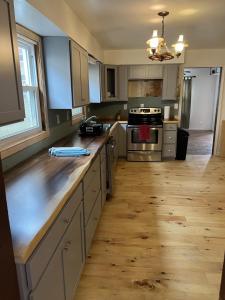 a kitchen with wooden floors and a counter top at Water Front Oasis home in Norfolk