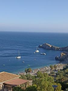 a view of a beach with boats in the water at ADNANIa 2023 in La Herradura