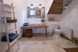 a bathroom with a sink and a toilet at Casa del Museo - Agua in Medina Sidonia +39 photos