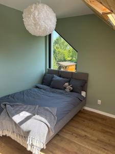 Кровать или кровати в номере Liwia Park Green House