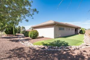a house with a golf course in front of it at Prescott Luxury Home near Golf Course and Airport home in Prescott Valley