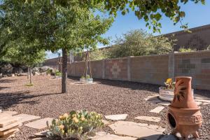 a garden with a fence and some plants at Prescott Luxury Home near Golf Course and Airport home in Prescott Valley