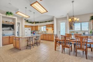 a kitchen and dining room with a table and chairs at Prescott Luxury Home near Golf Course and Airport home in Prescott Valley