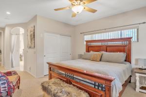 a bedroom with a bed and a ceiling fan at Prescott Luxury Home near Golf Course and Airport home in Prescott Valley