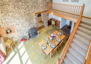 an overhead view of a dining table and a brick wall at The Little Barn in Felbrigg