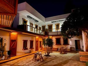 a courtyard of a building at night at Bodrum Konağı in Bodrum City