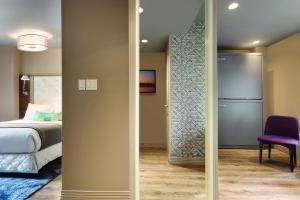 Ein Bett oder Betten in einem Zimmer der Unterkunft The Gallivant Times Square