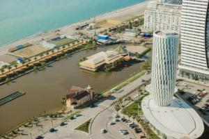 an aerial view of a city with a river at 5* Hotel Orbi City in Batumi