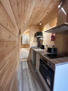 a small kitchen with a stove and a counter top at Foundry Farm Arch in Bellingham