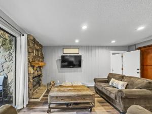 a living room with a couch and a fireplace at CM325 Copper Mtn Inn condo in Copper Mountain