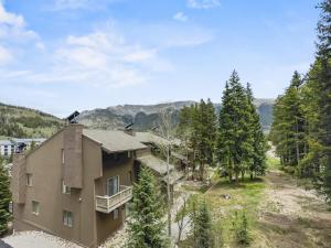 an aerial view of a building with mountains in the background at CM325 Copper Mtn Inn condo in Copper Mountain