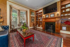 a living room with a couch and a fireplace at Stonegate in Lexington