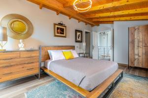 a bedroom with a bed and a wooden ceiling at Villa Nirvana in Áyioi Dhéka