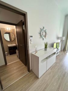 a bathroom with a sink and a mirror on the wall at Bala Beach Siófok Apartman in Siófok