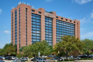 a building with a sign on top of it at The Westin Dallas Fort Worth Airport in Irving