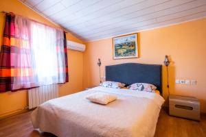 a bedroom with a bed and a window at Guesthouse Istra Premantura in Premantura