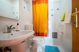 a bathroom with a sink and a toilet at Guesthouse Mirjana in Premantura +80 photos