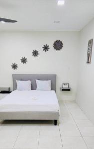 a white bedroom with a bed with white floors at Vibrant Studio Near the Beach in Jan Thiel