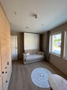 a living room with a couch and a table at Studio Leiligheit in Sogndal