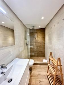 a bathroom with a sink and a toilet and a shower at Old Town Modern Flat, 4 Minutes From Beach - EaW Homes in Marbella
