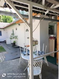 a table and chairs sitting on a patio at Balassa House in Siófok