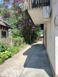 a walkway leading up to a building with a balcony at Balassa House in Siófok +119 photos