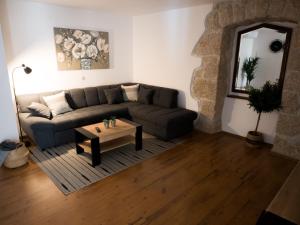 a living room with a couch and a coffee table at Holiday Home Vera in Malinska
