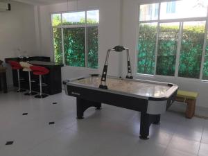 a ping pong table in the middle of a room at Casa Campestre en Melgar in Melgar