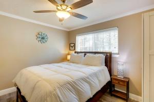 a bedroom with a bed with a ceiling fan at Homey South Lake Tahoe Getaway - 1 Mi to Beach in South Lake Tahoe