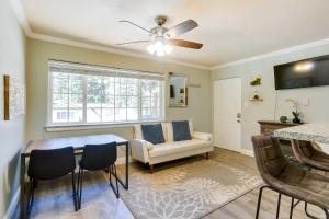 a living room with a table and a couch at Welcoming South Lake Tahoe Rental Near Beaches in South Lake Tahoe