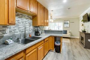a kitchen with wooden cabinets and a sink at Welcoming South Lake Tahoe Rental Near Beaches in South Lake Tahoe