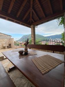 a wooden table with a vase on top at Mostar View House in Mostar