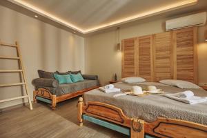 Posteľ alebo postele v izbe v ubytovaní Iniohos Zante Hotel & Suites