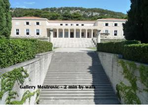 a staircase leading to a large white building at Apartments Emi in Split