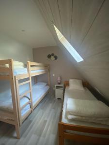 Postel nebo postele na pokoji v ubytování Gîte de montagne