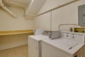 a white laundry room with a washer and dryer at Autumn Foliage 209 in Breckenridge +50 photos