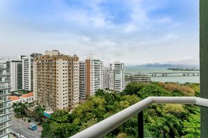 a view of a city with tall buildings at WI-FI 500MB | Pool | Balcony with Sea View #CA46 in Florianópolis