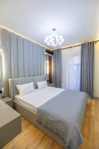 a bedroom with a large bed in a room at Glinka apartment in nukus street in Tashkent