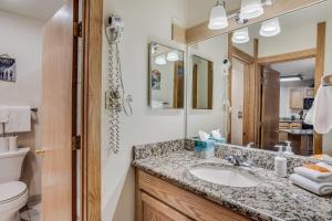 a bathroom with a sink and a toilet at Laurelwood Condominiums 307 in Snowmass Village +18 photos