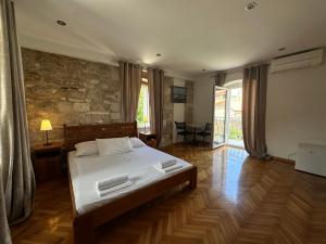 a bedroom with a bed in a room at Villa Dante in Trogir