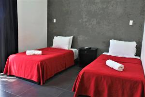 Кровать или кровати в номере Hotel Colonial Playa del Carmen